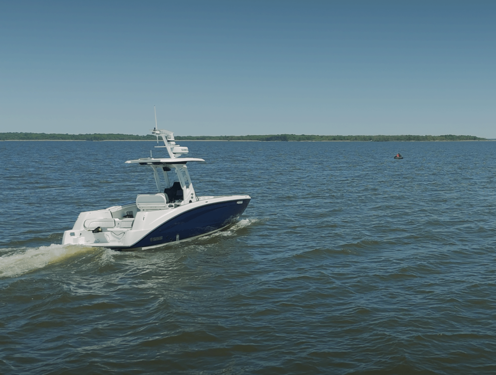 TILT MARV vessel in open water autonomously approaches a floating target during testing, equipped with radar and comms.